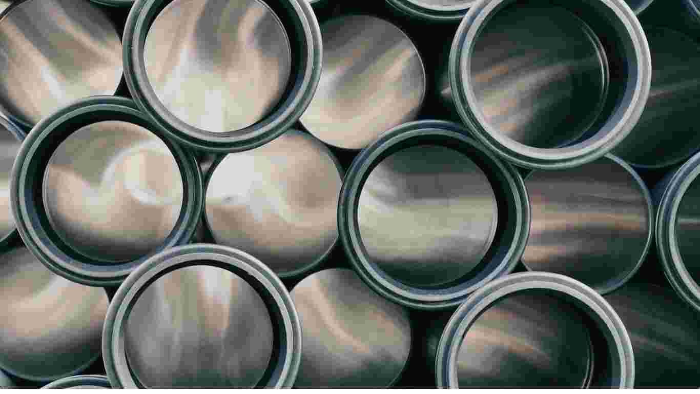 Close-up of genuine OEM factory tractor parts stamped with the manufacturer's logo, ready for installation.